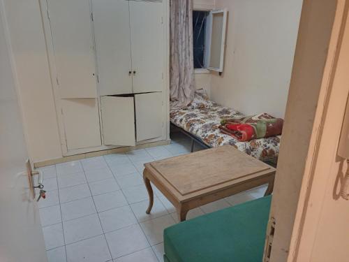 a small room with a couch and a table at single bed small room in Casablanca