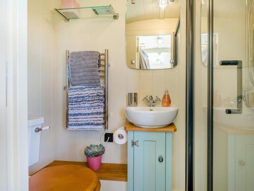 a small bathroom with a sink and a mirror at 1 Bed in Leominster oc-93060 in Pembridge