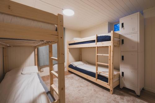 a bunk bed room with two bunk beds in it at NORD Apartment in Tromsø