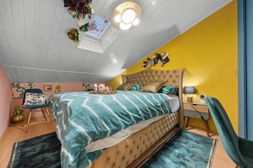 a bedroom with a large bed and a yellow wall at Vila Andja in Banjole,Istrien by Istrabook in Banjole