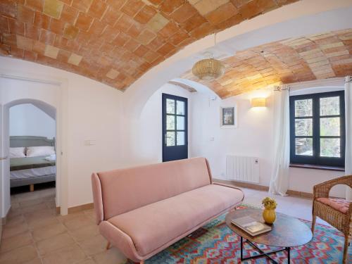 a living room with a couch and a table at Apartment at Cadaqués Church in Cadaqués