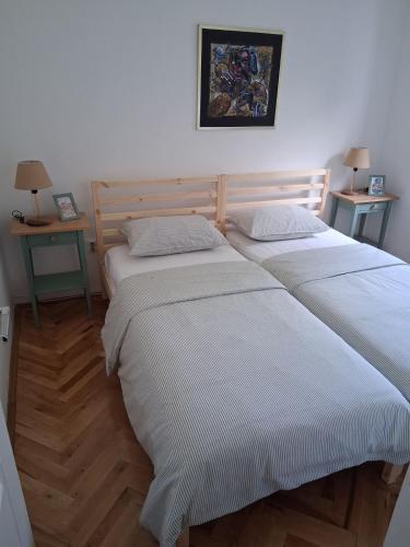 two beds in a room with two lamps and two tables at Budva City - Villa Antic - Private Pool in Budva