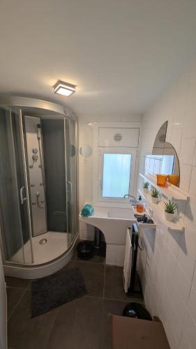 a bathroom with a tub and a sink and a shower at Tutto Passa Lloret in Lloret de Mar