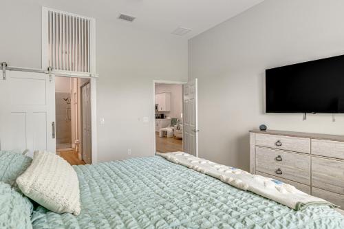 a bedroom with a bed with a television on the wall at Pool Access + Course View: Golf Getaway in Sebring in Sebring