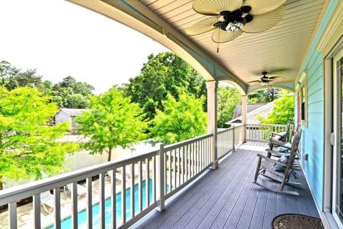 a porch with two chairs and a ceiling fan at The Palm Luxury Beach House w Pool and Game Room in Myrtle Beach
