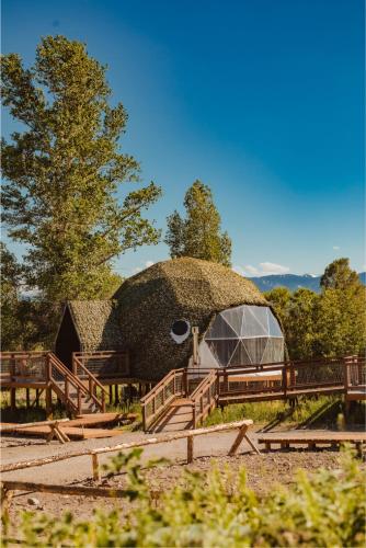 a large building with a dome with a tree at Tammah Jackson Hole in Wilson