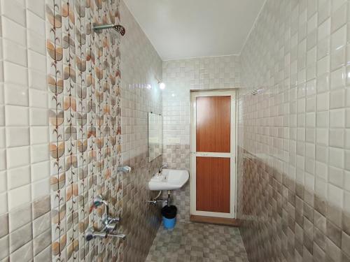 a bathroom with a sink and a toilet in it at Dacha by Great Host in Arambol
