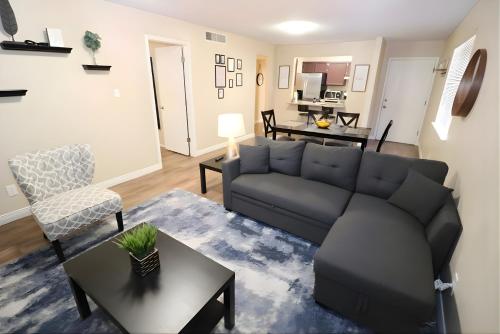 a living room with a couch and a table at Two king, Cozy & Comfy! in El Paso