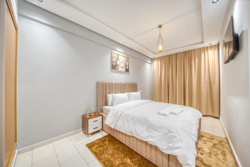 a hotel room with a bed and a television at JASMINe in Marrakesh