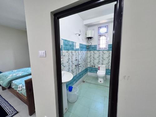 a bathroom with a tub and a toilet and a sink at YNL HOMESTAY a boutique hotel in Dirang Dzong