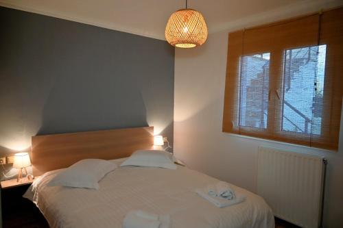a bedroom with a bed with two towels on it at Thea Hill in Kritharia