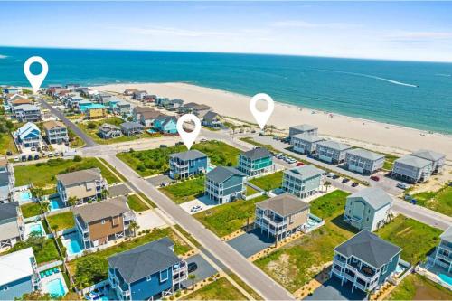 an aerial view of a resort with a beach at 5 BR Poolside Paradise Just Steps from the Beach in Ocean Isle Beach