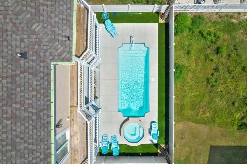 an overhead view of a swimming pool in a building at East End Views in Ocean Isle Beach