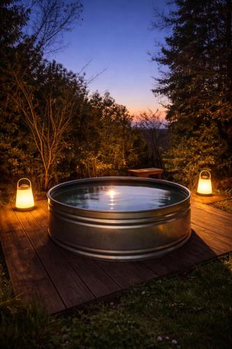 a hot tub on a wooden deck with two lights at Ruhestifter-Salem mit Aromasauna und Hot Tub bis zu 10 Personen in Salem