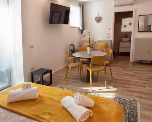 a living room with a table and a dining room at Da Franca in Riva del Garda