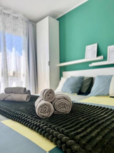 a room with a bed with three rolled towels at NextGen Casa Pepa I Terrace & Pool Fuerteventura in Costa de Antigua