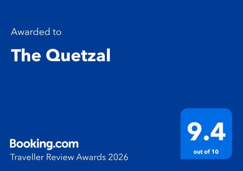 a blue square with the text awarded to the quaterral traveller review at The Quetzal in Cancún