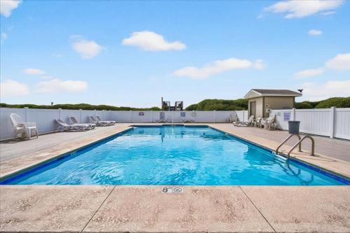 a swimming pool on top of a house at Castle By The Sea Beach Front Condo in Ocean Isle Beach