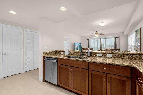 a kitchen with a sink and a counter top at Beachfront Condo with Spacious Balcony in Daytona Beach
