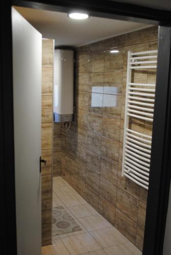 a bathroom with a shower with a glass door at DIÓ Vendégház in Balatonfenyves