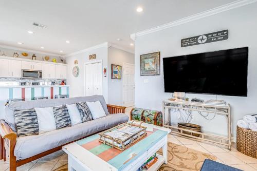a living room with a couch and a flat screen tv at Gulf Breezes Unit A in Port Aransas