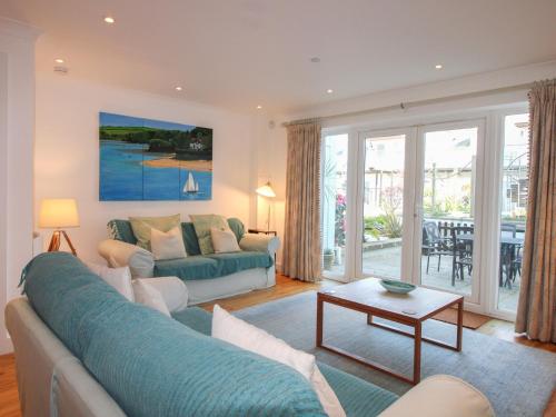a living room with a couch and a table at 16 Bolt Head in Salcombe
