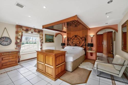 a bedroom with a large bed and a desk at 9 Bed in Alkham oc-m34784 in Swingfield