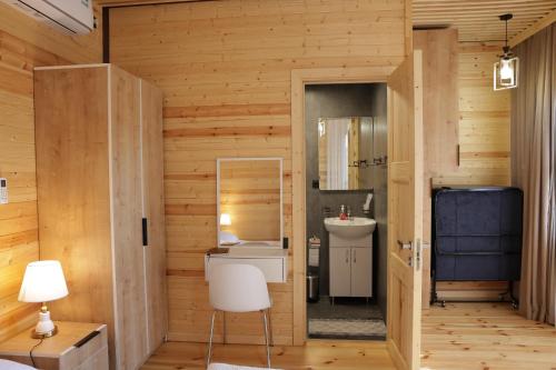 a room with a bathroom with a sink and a mirror at Armenian Corner Hotel in Pʼarakʼar