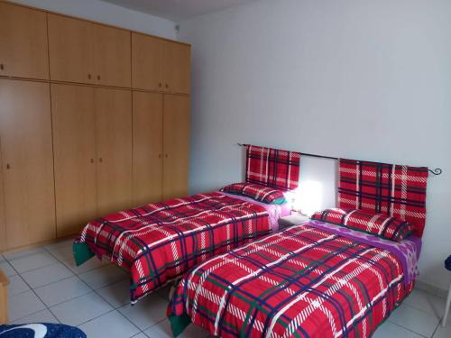 two beds sitting next to each other in a bedroom at Casa Vallati in Scardovari