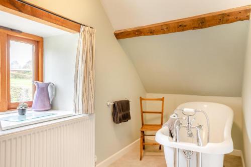 a bathroom with a sink and a window at 1 Bed in Taunton oc-bartc in West Monkton