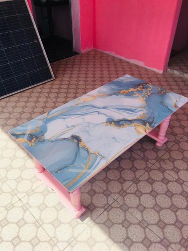 a bed sitting on the floor in a room at Casa da BARBIE Praia in Itapipoca