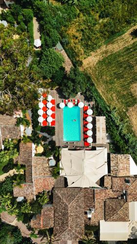 an overhead view of a building with a pool at Hôtel La Tartane Saint-Tropez in Saint-Tropez