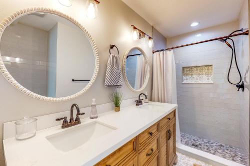 a bathroom with a sink and a mirror at Mardi Gras Parade, Walk to Beach! Bay St Louis Gem in Bay Saint Louis