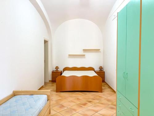 a bedroom with a bed in a room at Antico Casale Ventotene in Ventotene