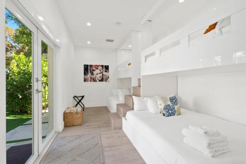 a white living room with a white couch at Havana House Miami in Miami