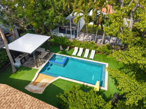an overhead view of a backyard with a pool and a table at Havana House Miami in Miami