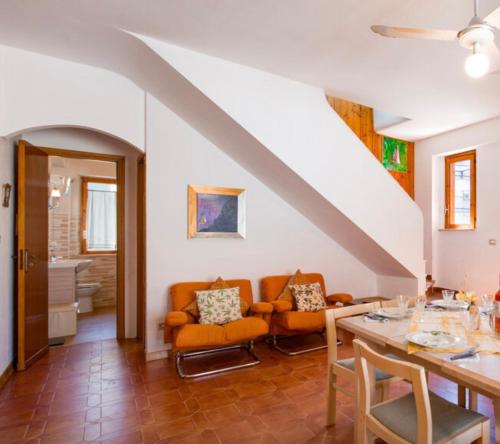 a living room with a table and chairs at La Casa di Teresa in Scalea