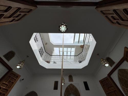 a ceiling view of a staircase in a house at Riad AYA in Rabat