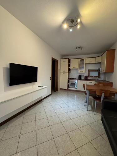 a living room with a flat screen tv on a wall at Volpes home in Desenzano del Garda