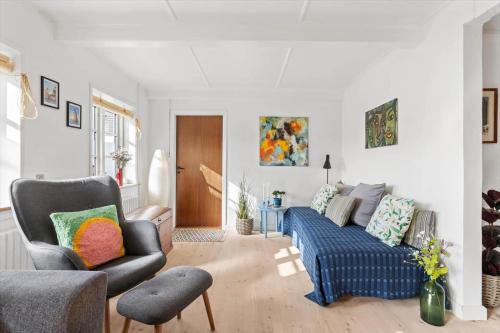 a living room with a couch and a chair at AE324-Marstal-Kirkestraede-31 in Marstal