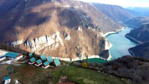 an aerial view of a mountain with a river at Rural Resort Tron in Plužine