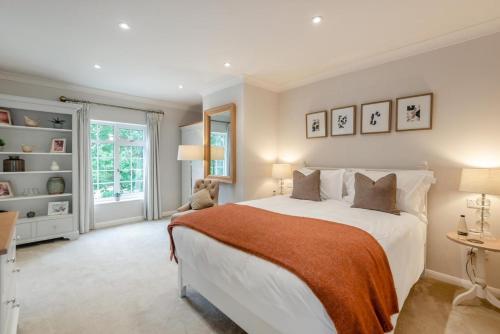 a bedroom with a large white bed and a window at 4 Bed in Bray oc-b32610 in Bray