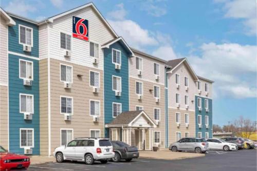 a large building with cars parked in a parking lot at Studio 6 Extended Stay Wichita South KS in Wichita