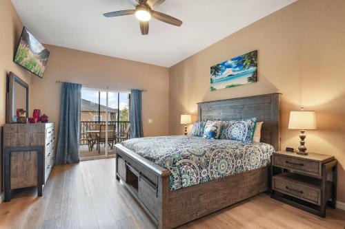a bedroom with a bed and a ceiling fan at Bahama Bay Huge Penthouse condo in Kissimmee