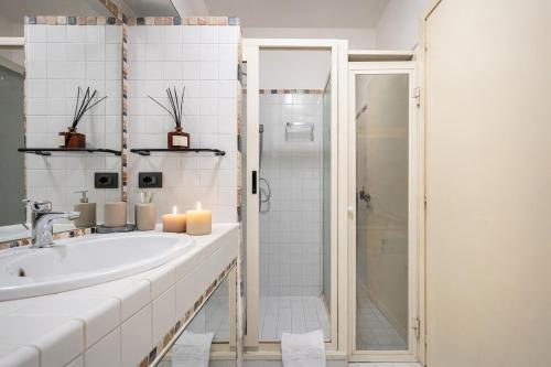a bathroom with a sink and a shower at Vittoria Residence Spanish Steps in Rome