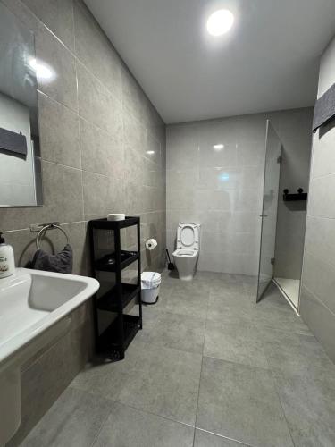 a bathroom with a sink and a toilet at LUGO Stay in Lugo