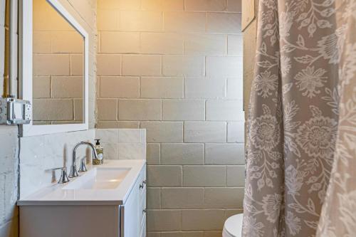 a bathroom with a sink and a shower curtain at Lake View, Pool Access! Pet-Friendly Hernando Stay in Hernando