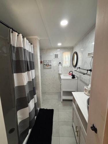 a bathroom with a shower curtain and a sink at Prime Crystal River location! in Crystal River