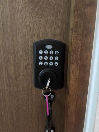 a key hanging from a door with a key chain at La Estancia del Rey David in San Luis Potosí