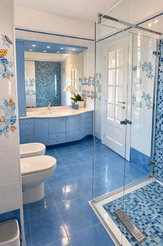 a bathroom with a shower and a toilet and a sink at Panoramic Apartment Sea & Vesuvio View, Sorrento Center, COSTA DEL SOLE in Sorrento